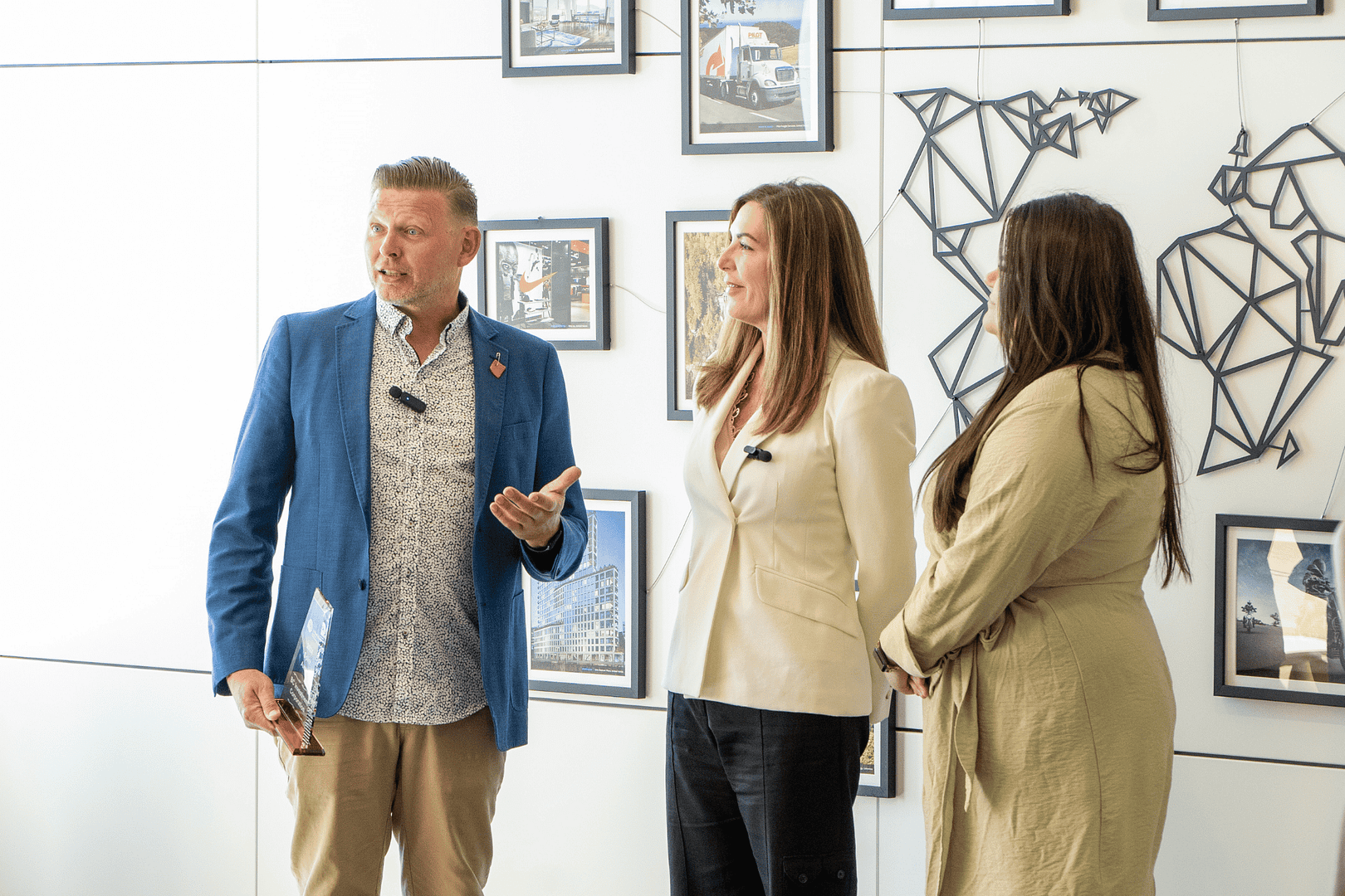 BCI employees being handed an award BCI employees being handed an award
