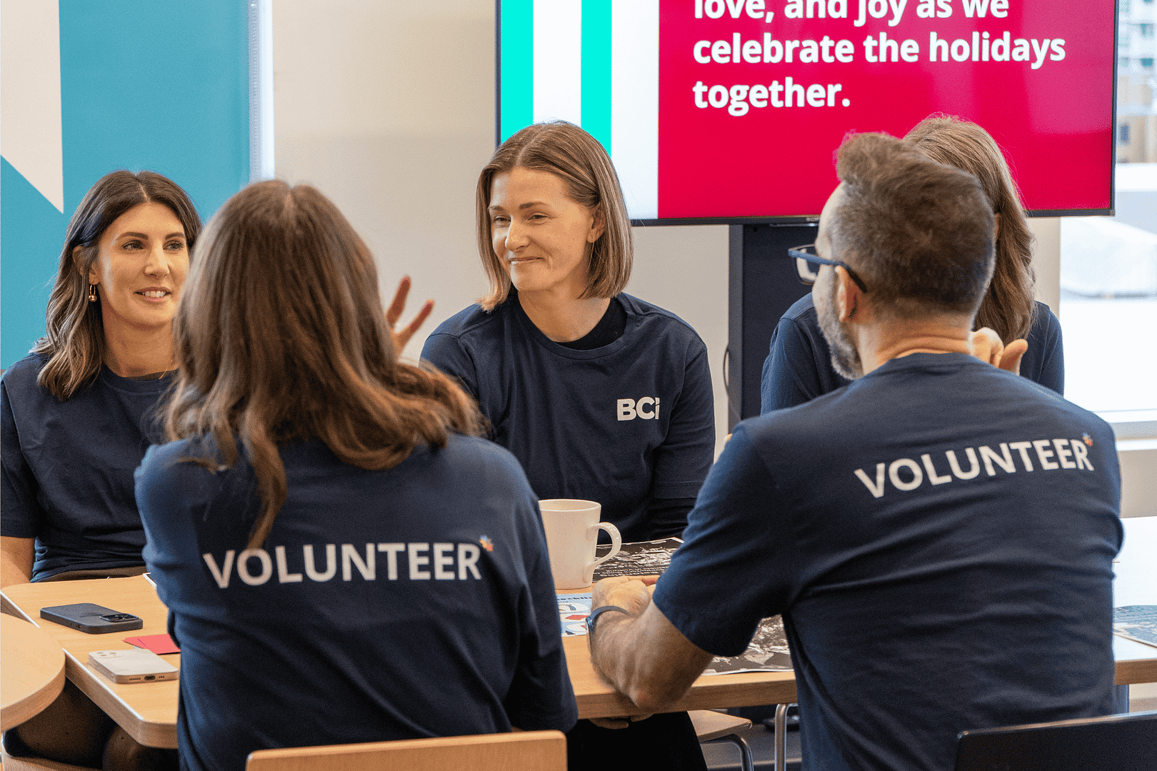 BCI volunteers sitting around a table BCI volunteers sitting around a table