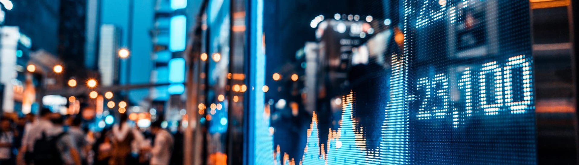 Closeup of stock market board in city at nighttime Closeup of stock market board in city at nighttime