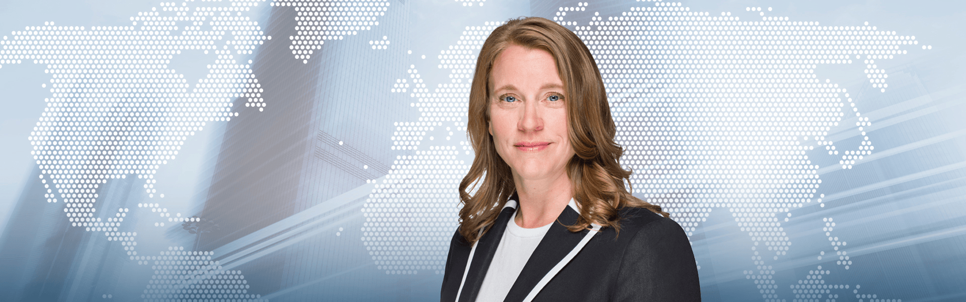 Jennifer Coulson in front of world map