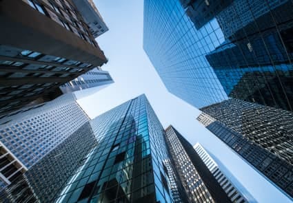 upward-facing angle of glass and modern skyscrapers upward-facing angle of glass and modern skyscrapers
