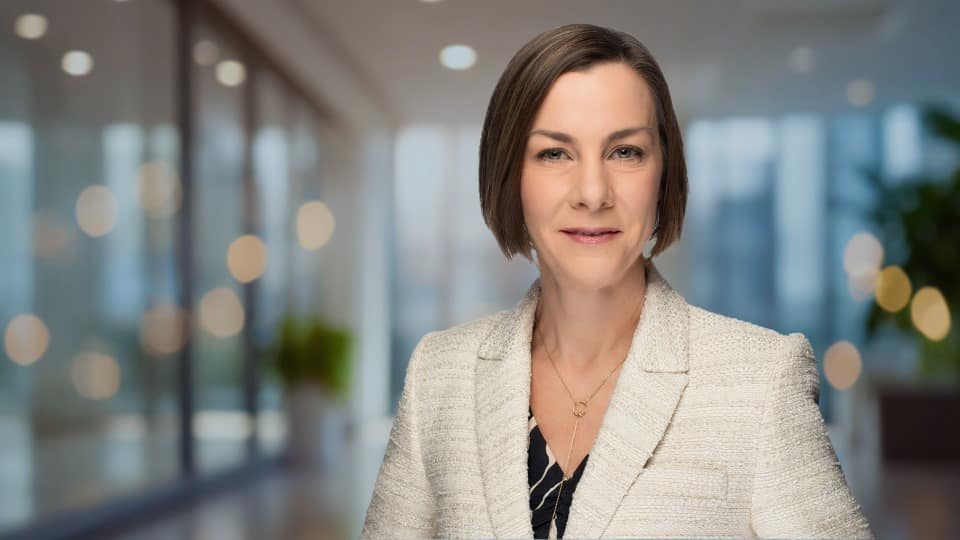 Image of Jennifer Schweers with blurry office background Image of Jennifer Schweers with blurry office background