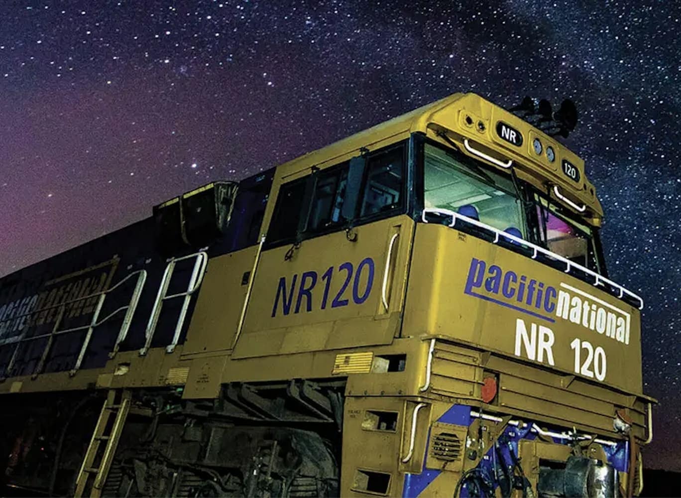 an image of a pacific national train against a starry night sky an image of a pacific national train against a starry night sky
