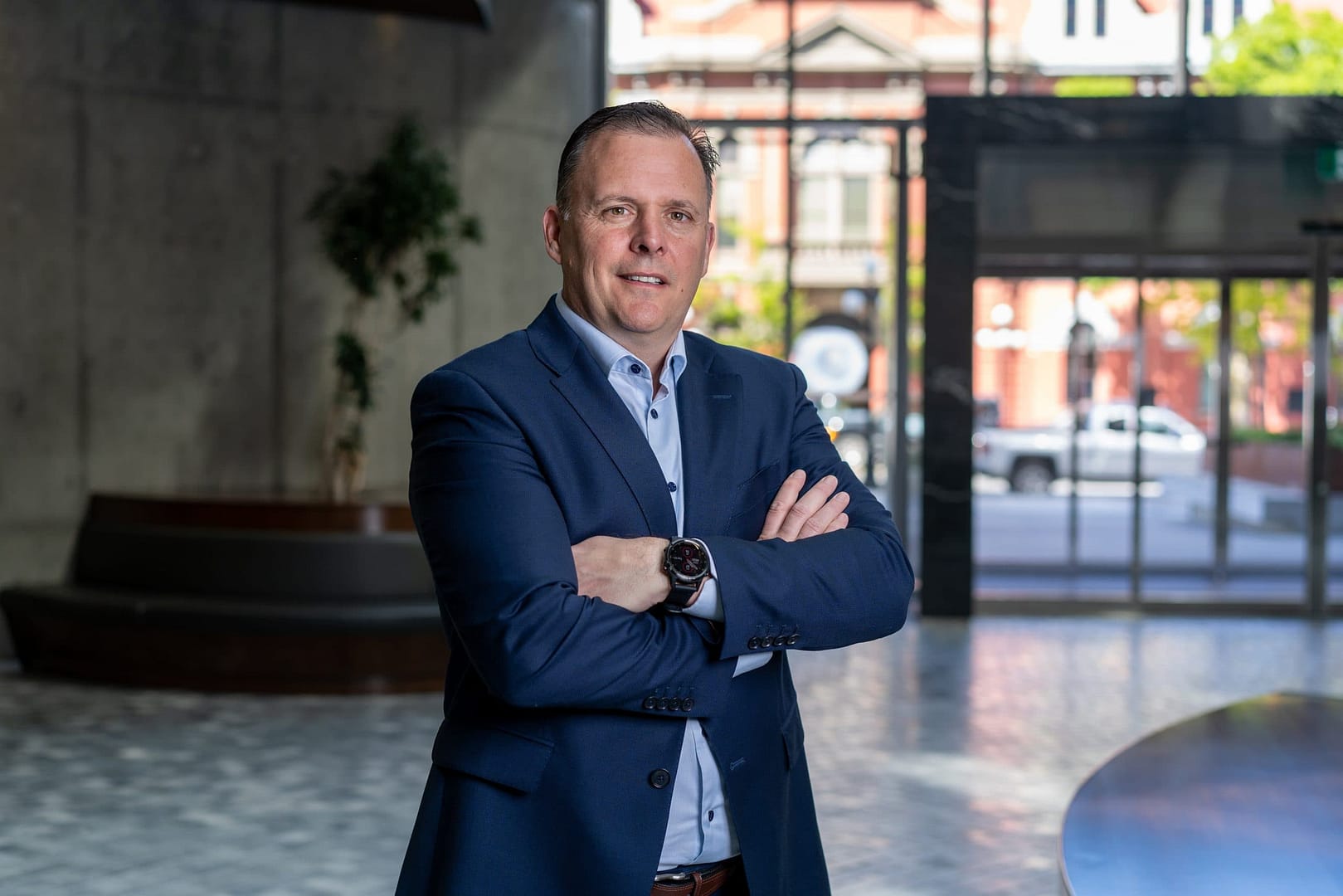 Jim Pittman standing in the lobby of a building.